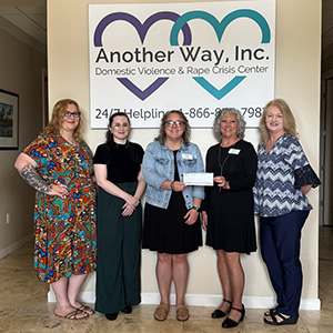 presenting May Charity of the month check - Another Way, Inc.
